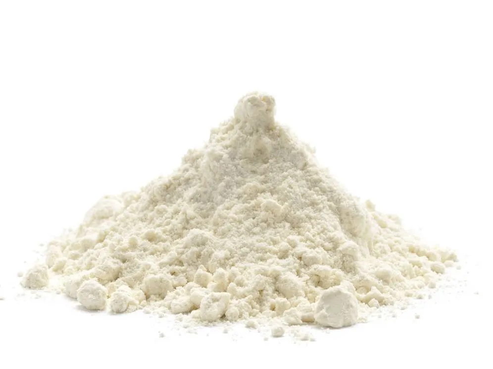 Small heap of xanthan gum powder, white and fine, on a white background