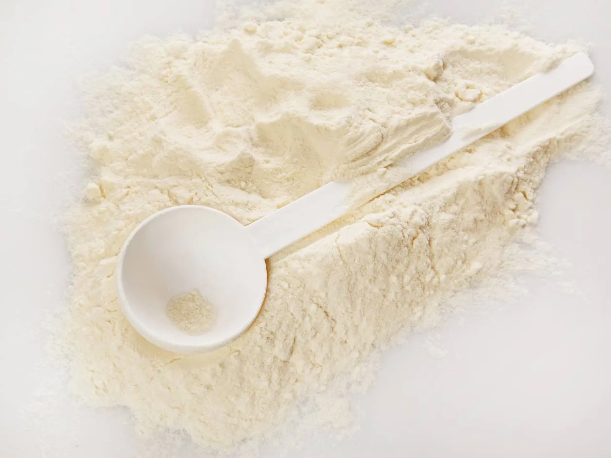 Powdered egg albumin with a white measuring spoon