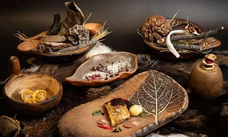 Still life of matured goat dishes served in bowls and on wooden boards