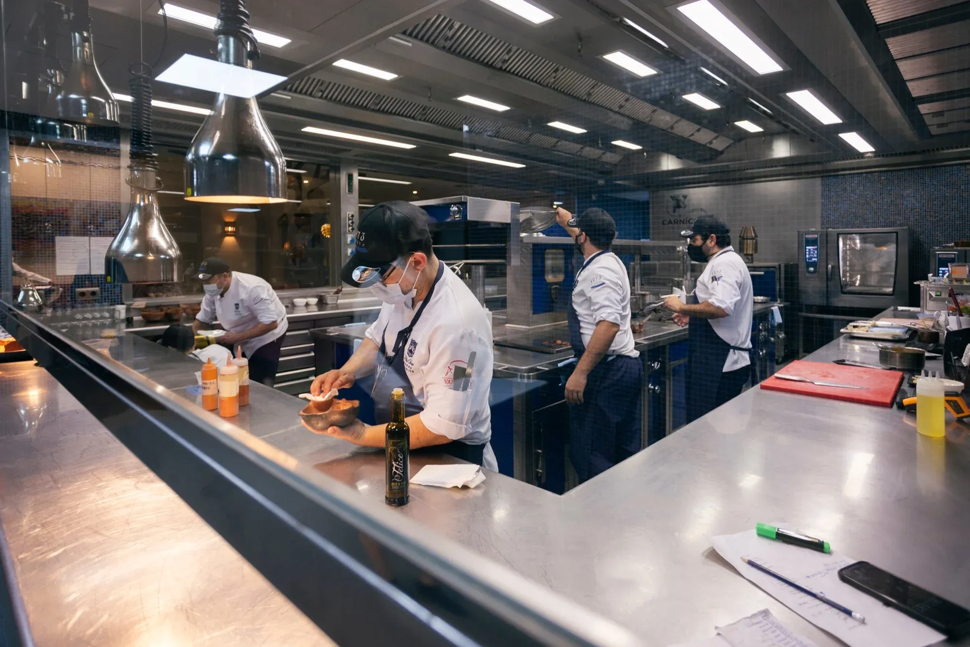 Cooks from Taste 1973 at work in the restaurant kitchen