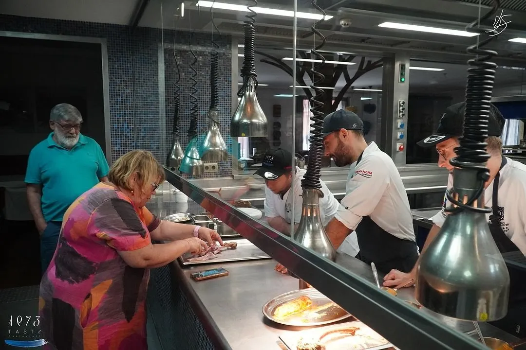 Behind the scenes of the new book, examining a piece of meat on the pass at Taste 1973