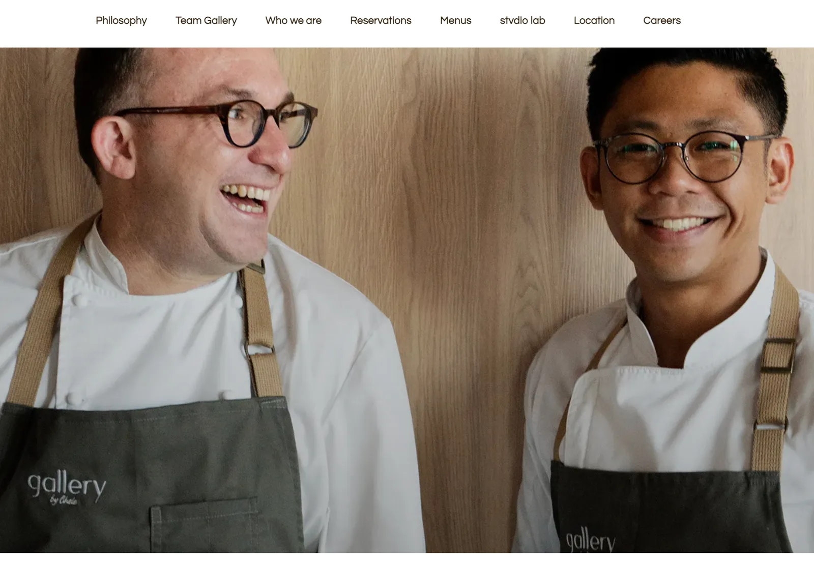 Gallery by Chele website: Chele González smiles alongside a cook from his team