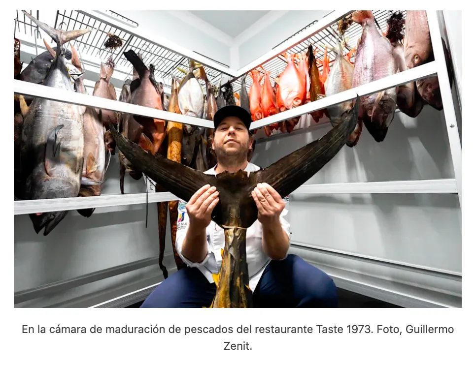 Diego Schattenhofer holding a matured fish inside the Taste 1973 ageing chamber