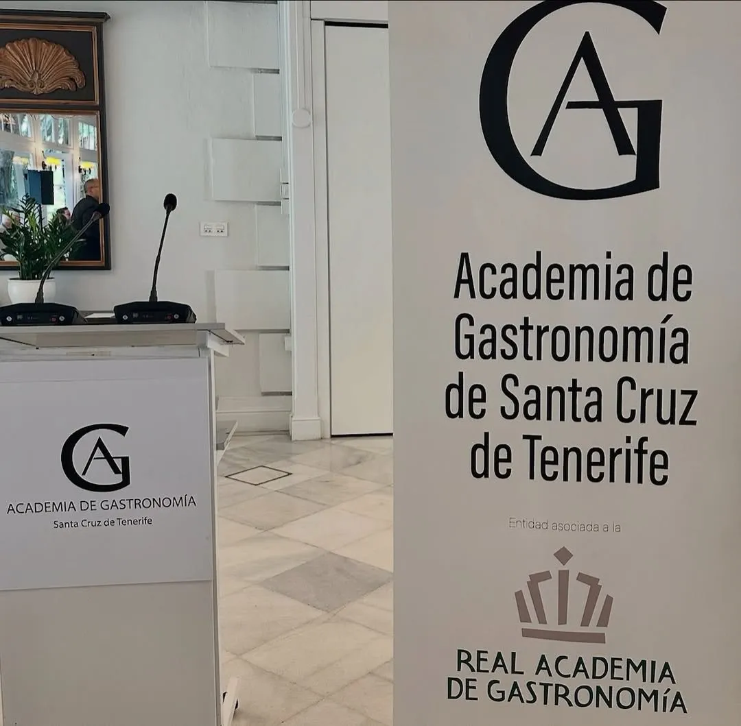 Lectern with microphones next to the Academia de Gastronomía de Santa Cruz de Tenerife’s sign