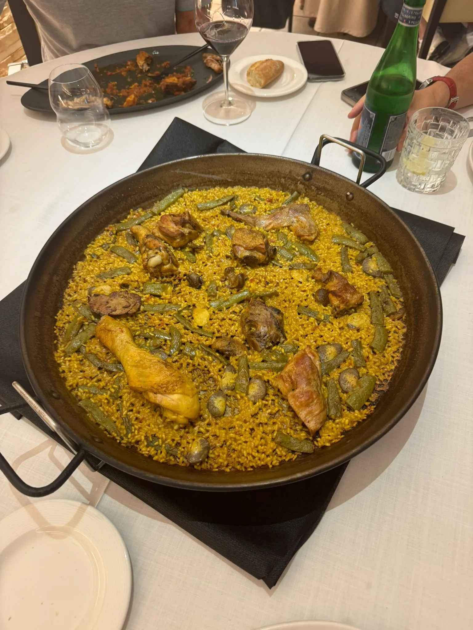 Finished Valencian paella with chicken, rabbit, green beans and snails