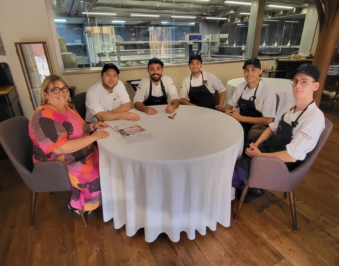 Kitchen team meeting with the project documentation on the table
