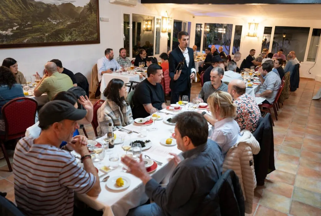 Diners seated at a long table during the welcome dinner