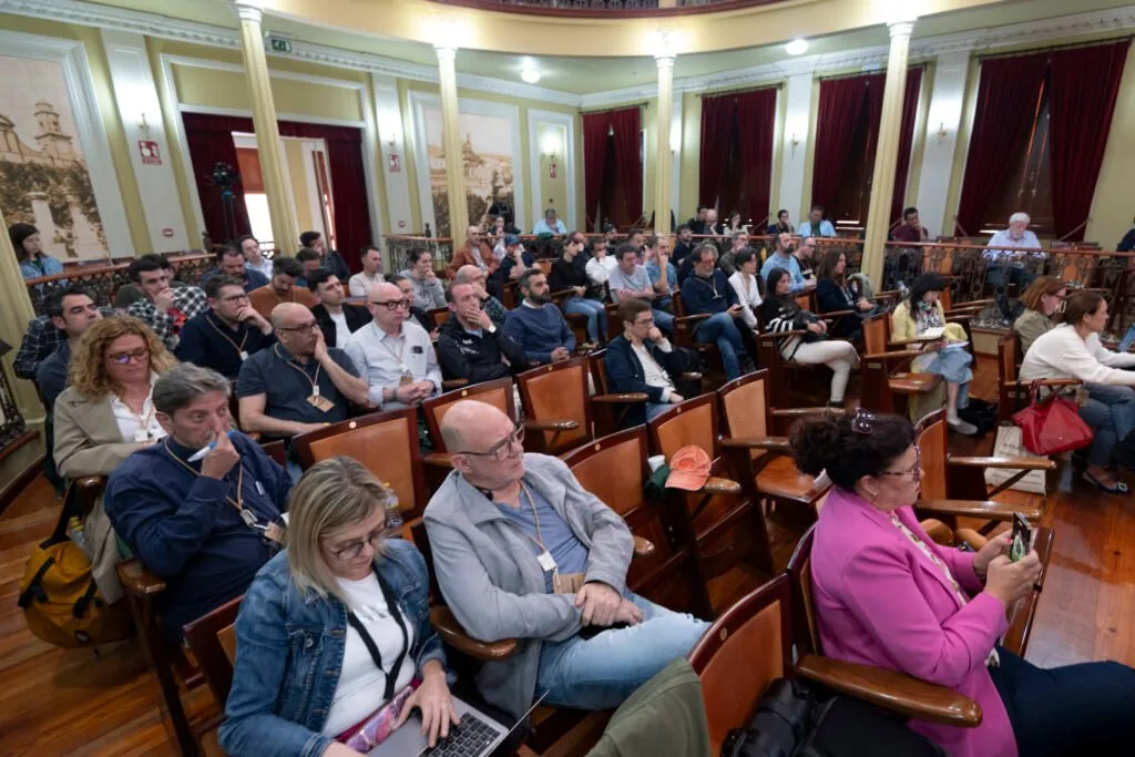 Audience following the presentations from the theatre seats