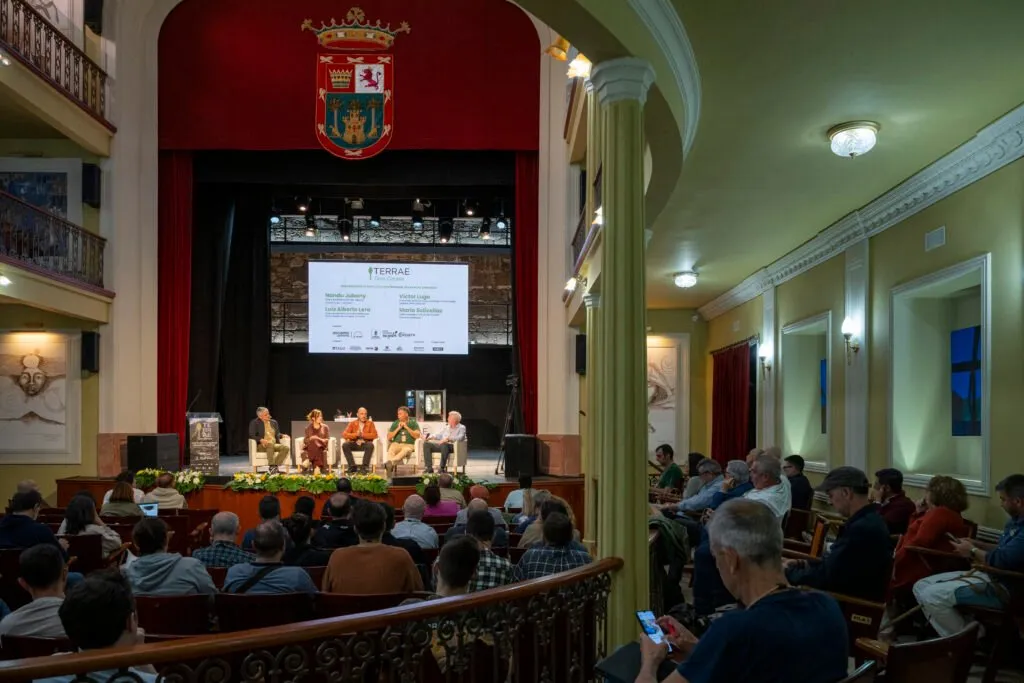 Round table on stage seen from the theatre stalls
