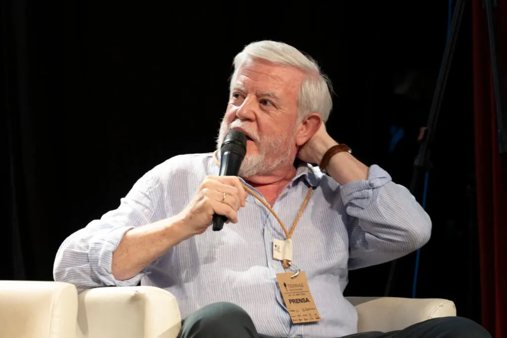 A speaker addresses the audience with the microphone during the round table