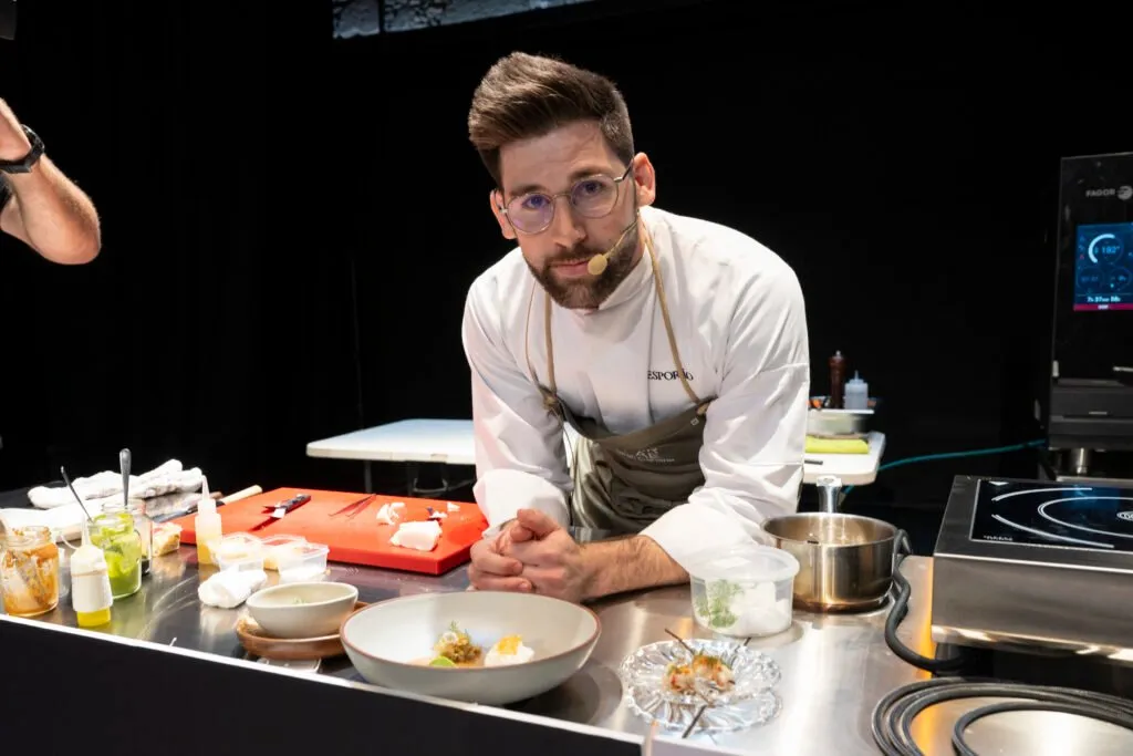 Chef behind the demonstration table during his presentation