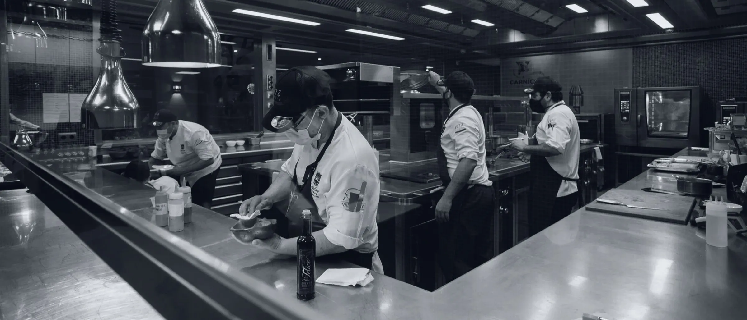 The Taste 1973 brigade at work on the kitchen pass, under the heat lamps