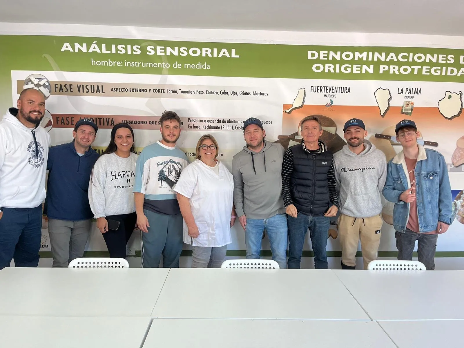 Group of researchers and cooks in front of a sensory analysis panel for cheeses with a protected designation of origin