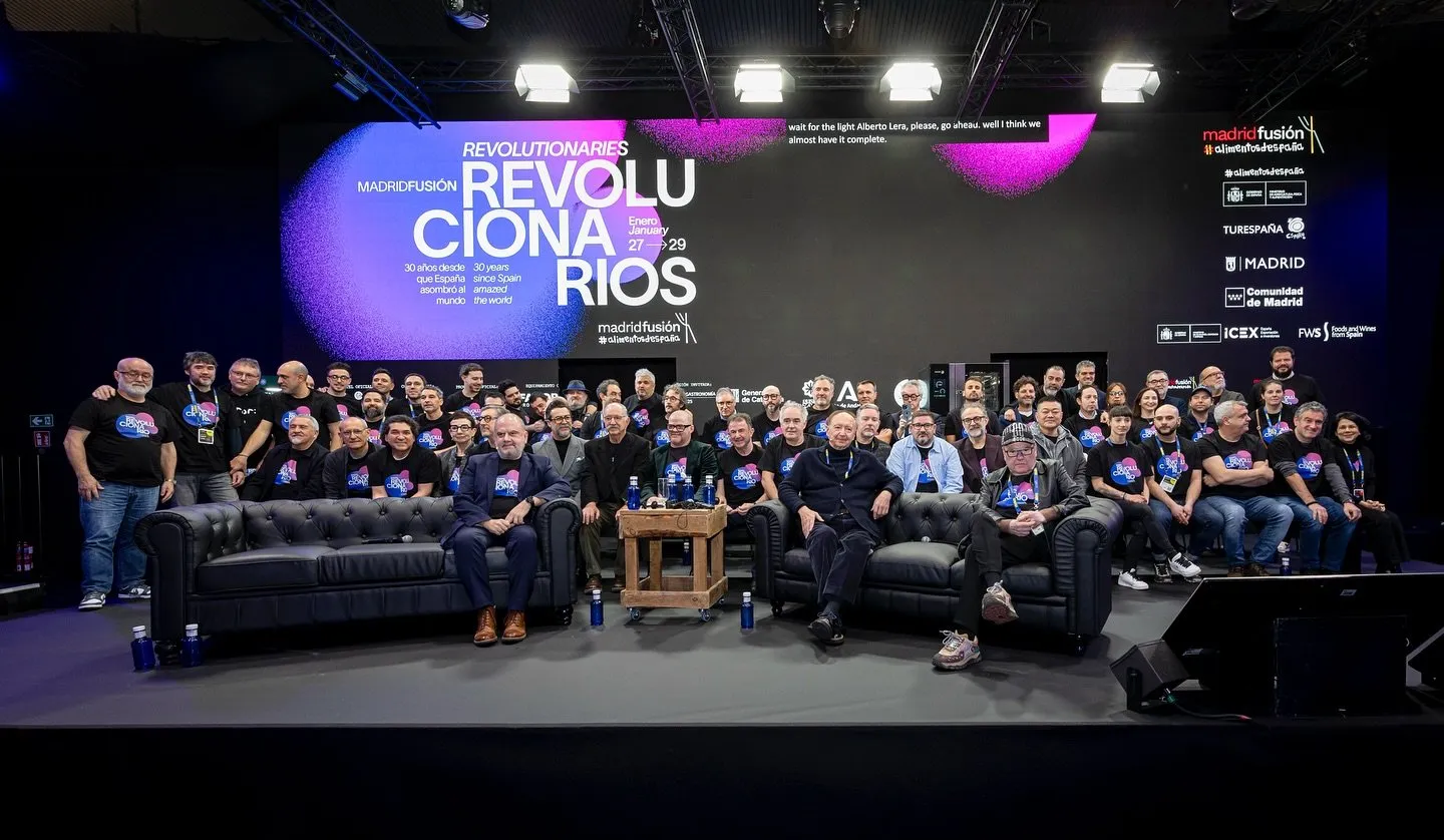 Group photo of the honoured chefs on the Madrid Fusión 2025 stage, under the «Revolucionarios» sign