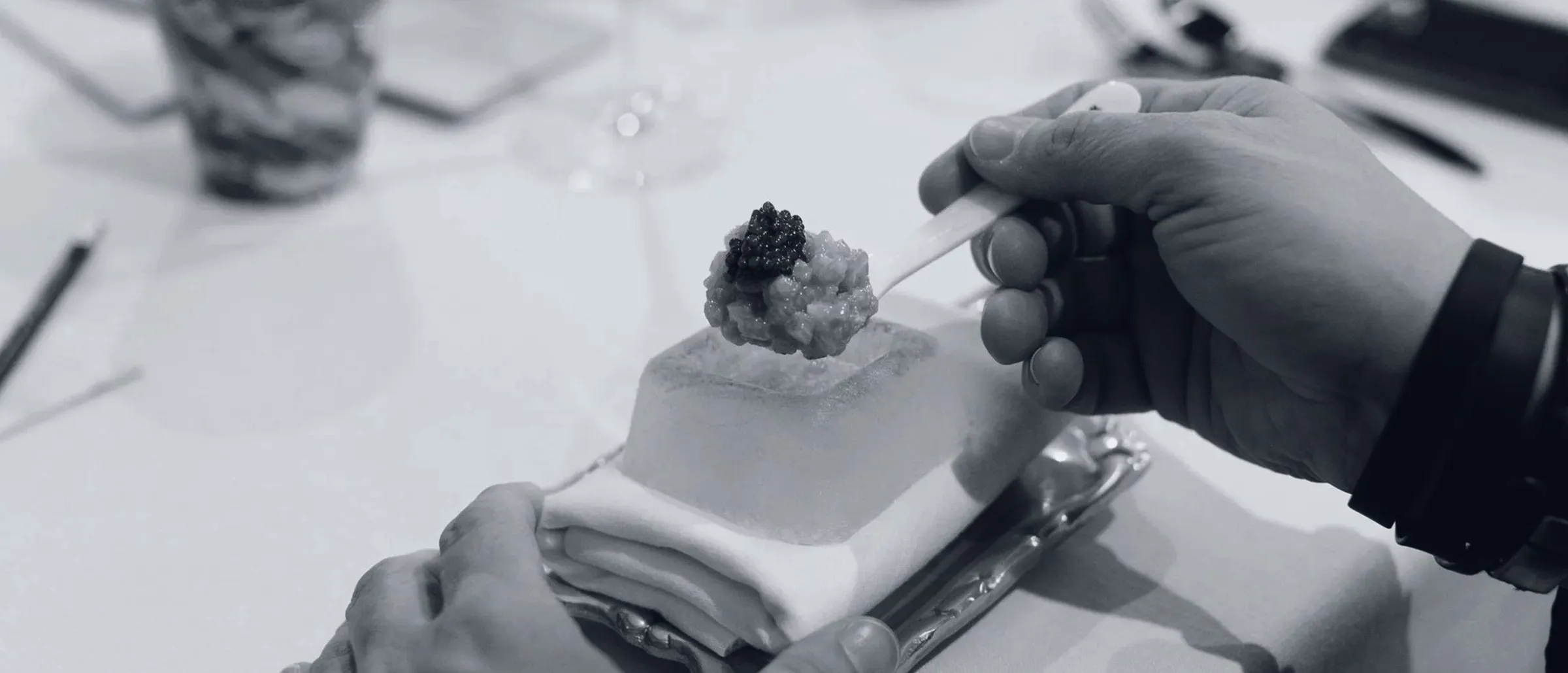 A dish with caviar on a block of ice at the pass, during service at Taste 1973